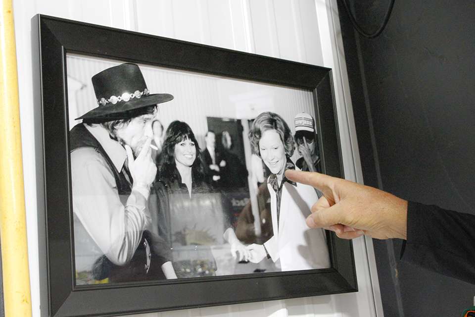 He enjoys this framed photo of Waylon Jennings meeting Jimmy Carter's wife, Rosalynn.
