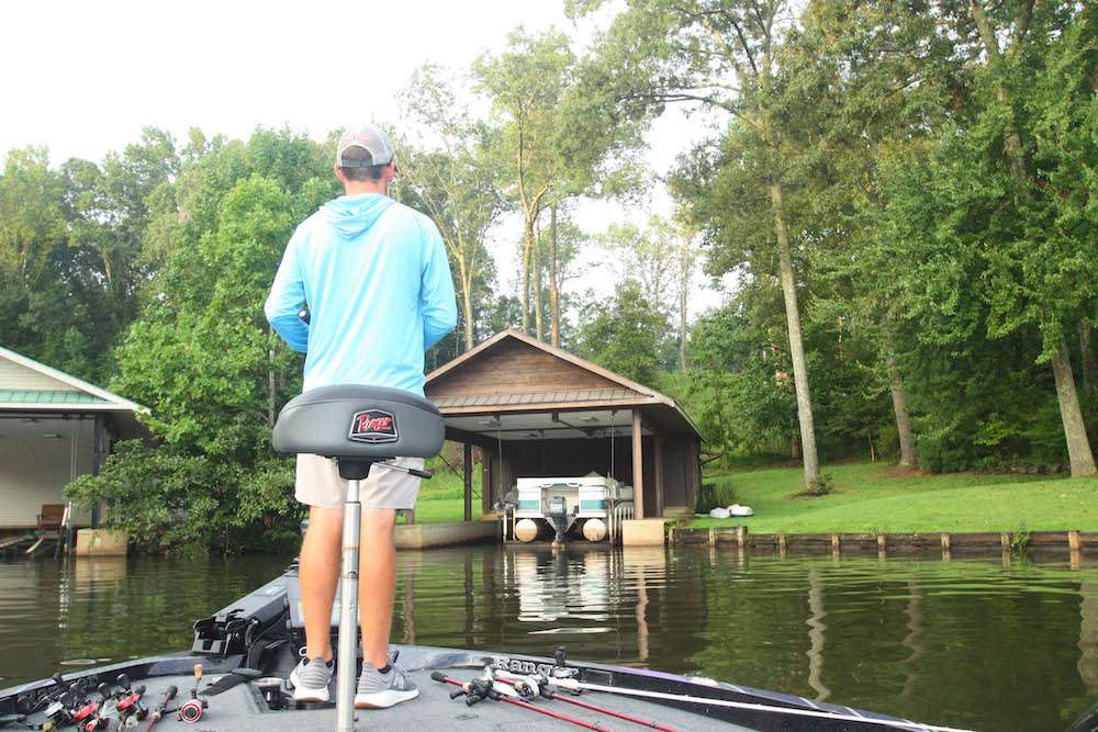 <b>7:12 a.m.</b> LeHew moves into a shallow cove and chunks the buzzbait around a boathouse. <br>
<b>7:16 a.m.</b> He flips a 1/2-ounce E.R. Lures jig in the Jasonâs magic color with a green pumpkin Berkley Chigger Craw trailer to the boathouse. <br>
<b>7:18 a.m.</b> LeHew is moving quickly around the cove while alternating between the buzzer and jig. <br>
<b>7:20 a.m.</b> He retrieves a sexy shad Berkley Choppo surface plug parallel to a seawall. âIâd hit that if I were a bass!â <br>
<b>7:27 a.m.</b> LeHew runs the Choppo across a rock point. No takers. <br>
<b>7:32 a.m.</b> LeHew has moved off the point and located a submerged brushpile in 10 feet of water. He tosses a 1-ounce Nichols spoon to the sunken shrubbery and jigs it repeatedly. âIâm using the LiveScope feature on my Garmin graph to pinpoint isolated cover. This technology is a total game changer.â <br>
<b>7:38 a.m.</b> LeHew returns to the shoreline and continues casting the Choppo while moving at a fast clip. <br>
<b>7:44 a.m.</b> LeHew cranks the Merc and begins idling around offshore while watching his electronics for submerged cover and baitfish. Thereâs a light breeze blowing out of the south.
<br><br>
<b>6 HOURS LEFT</b><br>
<b>7:50 a.m.</b> After marking a few brushpile waypoints on his graph, LeHew moves toward Lake Xâs northern shore and flips two docks with the jig. <br>
<b>7:57 a.m.</b> LeHew ties on a citrus shad Berkley Dredger 8.5 crankbait, casts it to a seawall and bags an 11-inch largemouth.

