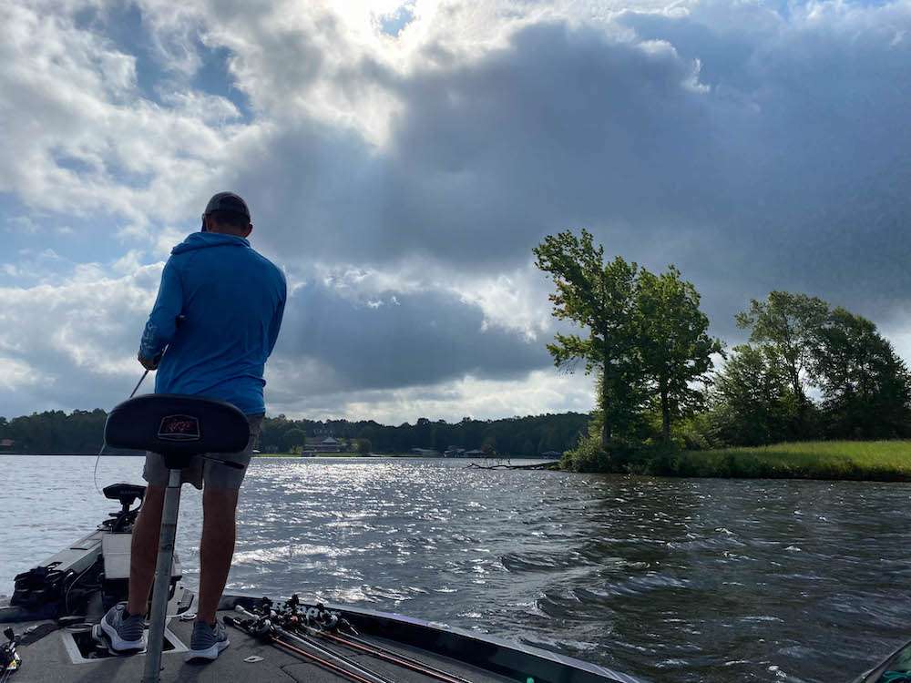 <b>9:25 a.m.</b> LeHew is marking fish on his electronics as he cranks the long point. âIâm not positive theyâre bass; they could be big crappie.â <br>
<b>9:34 a.m.</b> LeHew catches a tiny largemouth off the point on the 14.5. <br>
<b>9:38 a.m.</b> The wind has picked up and LeHew has dropped his Power-Poles to anchor his boat while he cranks the point. <br>
<b>9:42 a.m.</b> He cranks up another white bass. âIâm getting bites, but not from the right species.â
