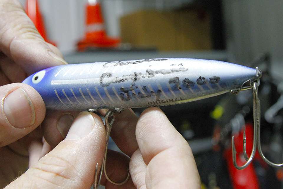 A topwater walking bait signed by the late great Charlie Campbell in July of 2000.