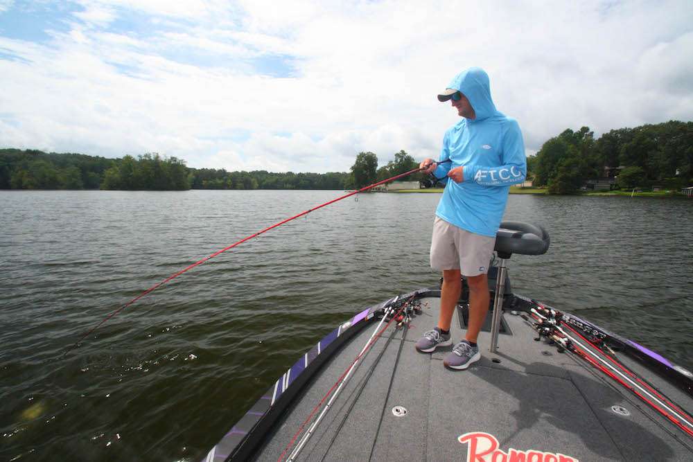 <b>12:35 p.m.</b> LeHew casts the shaky head to a brushpile just off the point. A good fish picks it up; LeHew slams back his rod and the bass bolts for open water.
