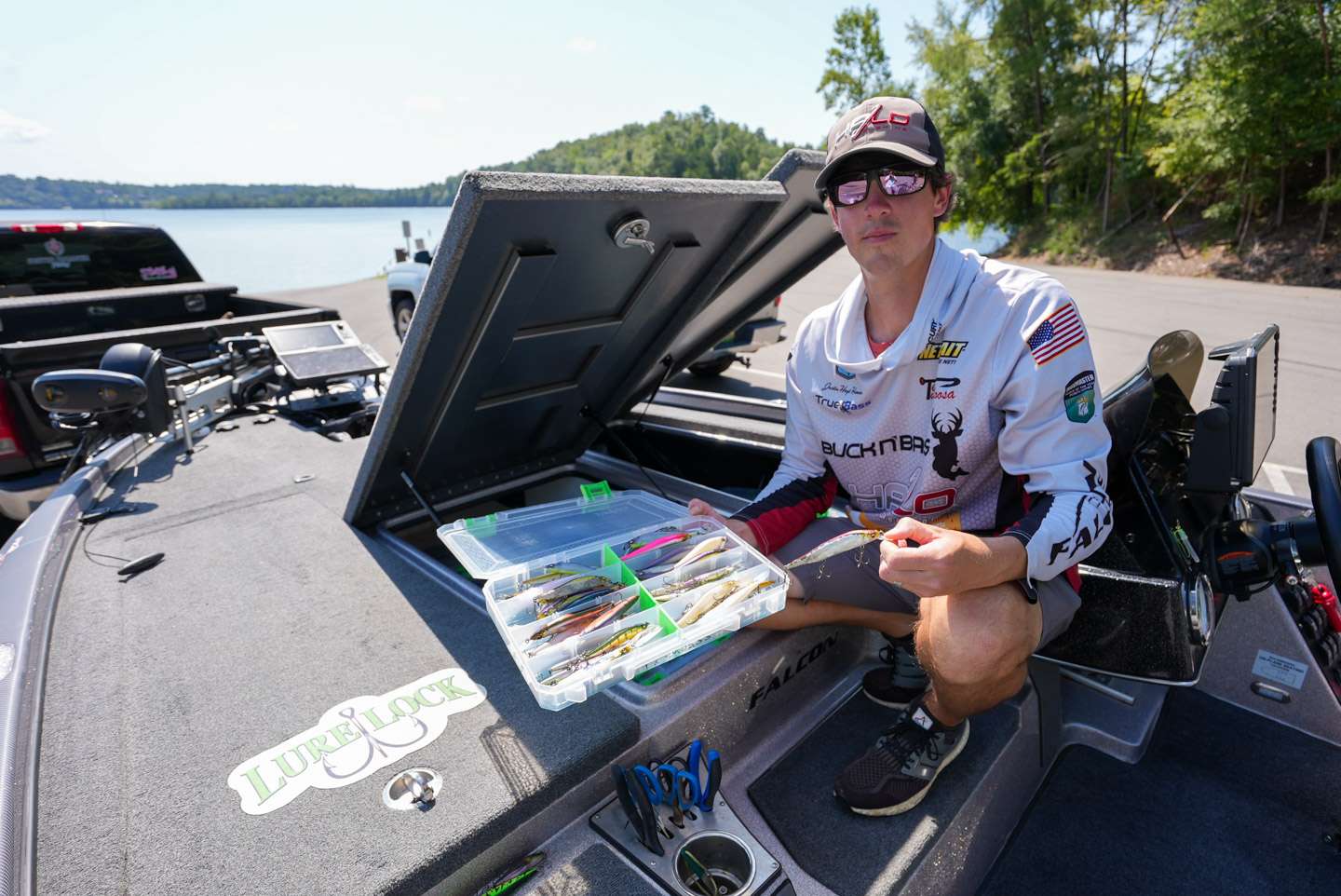 Hamner pulls out one of the three jerkbait boxes he keeps in the boat at all times. 