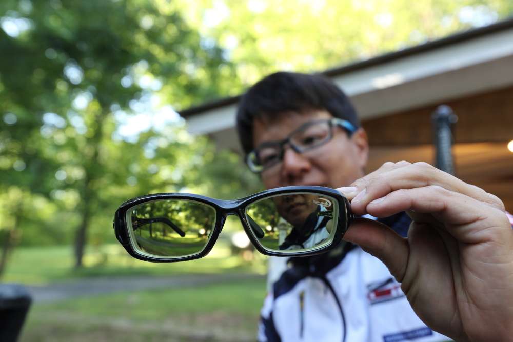 Like many Elites, Ito carries multiple pairs of glasses with different lens colors for different conditions. 