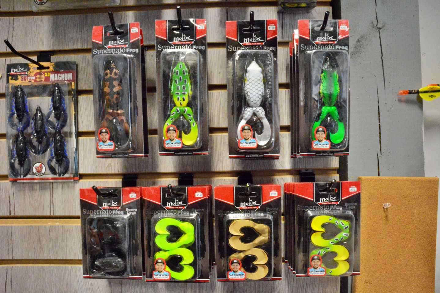 The man cave walls are lined with Carlâs top baits, including an assortment of the Molix Supernato Frog that he designed. âit combines the buoyancy and hydrodynamics of a traditional hollow body frog with a revolutionary tail design.â The high-density plastic tail has two inward facing appendages that create a hard, propeller-like sputter across the surface.