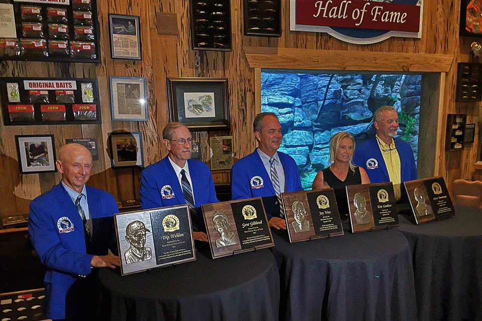 The inductees line up with their plaques int the Bass Fishing Hall of Fame on Sept. 30 at Johnny Morris Wonders of Wildlife in Springfield, Mo. Due to the pandemic, the last two classes were merged into one ceremony. From left are Trip Weldon, Gene Gilliland, Jay Yelas, Ron Lindnerâs daughter Dawn, and Steve Bowman.
