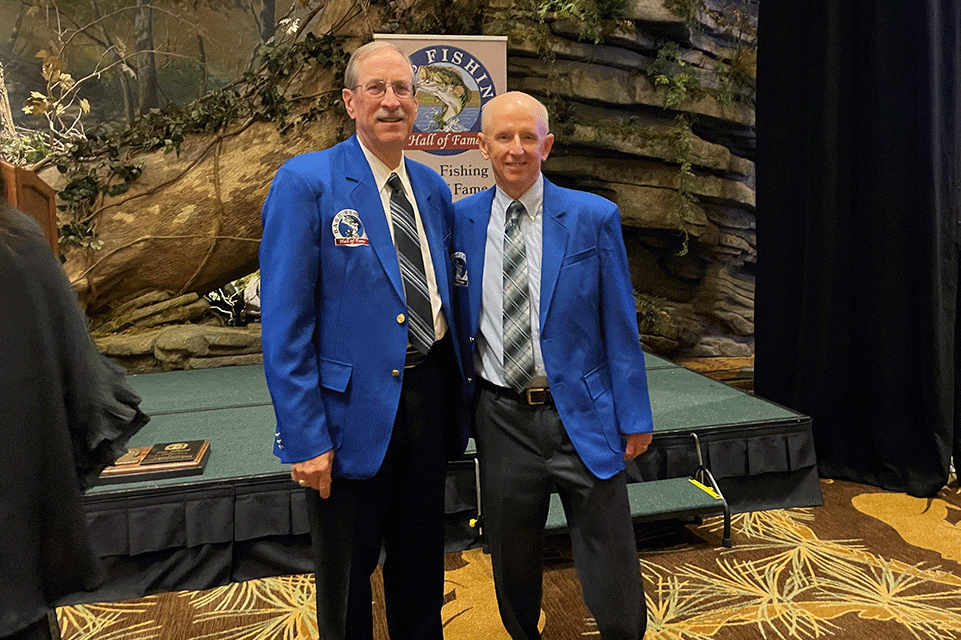Gene Gilliland and Trip Weldon have their photo taken after their induction speeches.