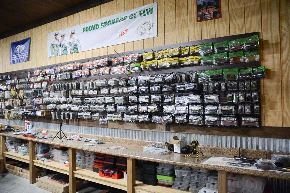 The Ranger Z521L is parked near to this tackle wall filled with baits, a work bench and below it, more storage space. The work bench runs the entire length of the wall. 