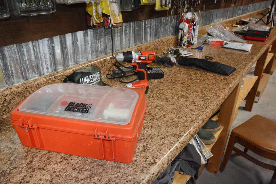 The workbench surface looks like what youâd find in a kitchen. Itâs decorative but functional. He can work on projects anywhere along the wall. 