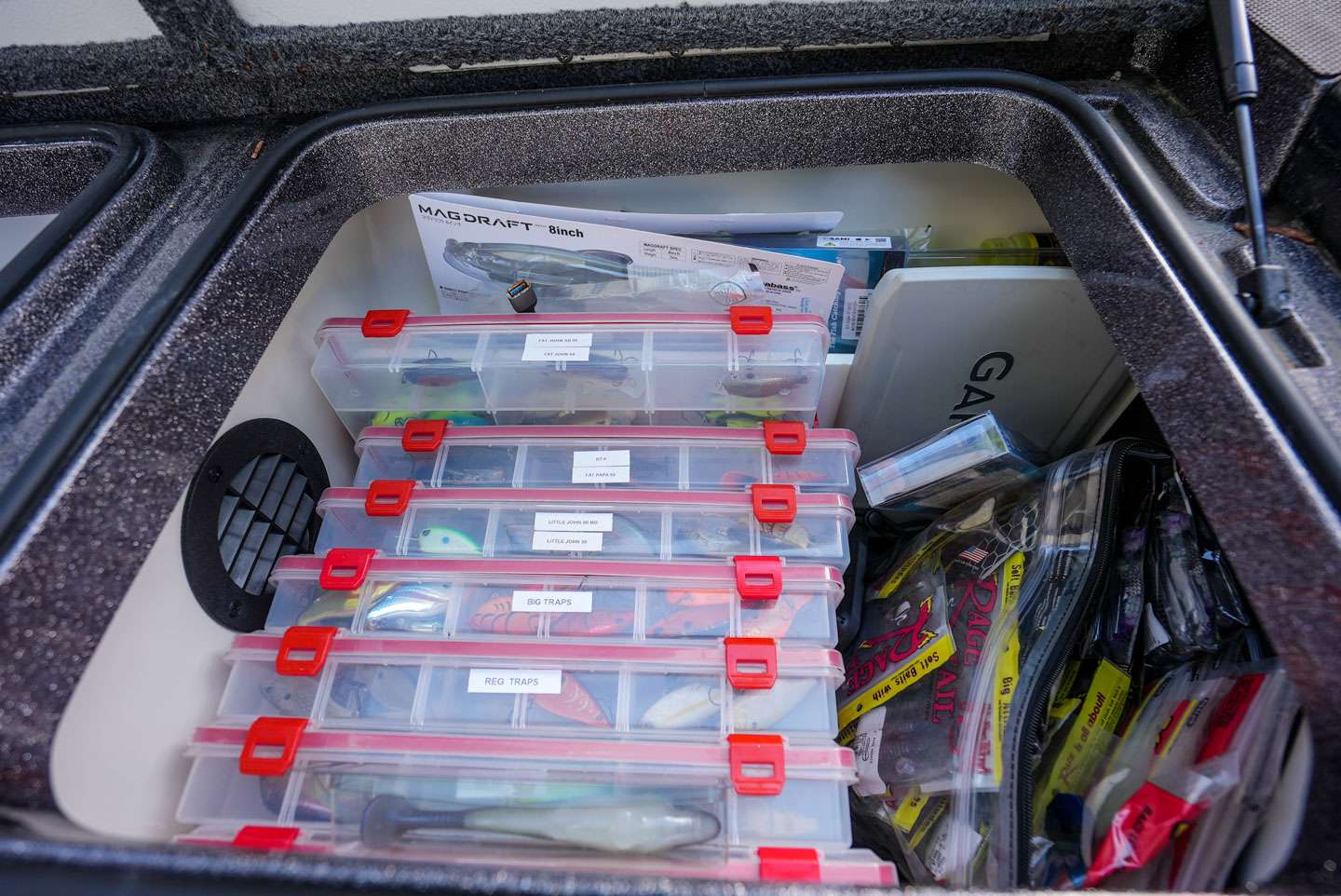 The small storage box behind the driver's side rod locker is home to more tackle. Mostly of the hard bait variety. 