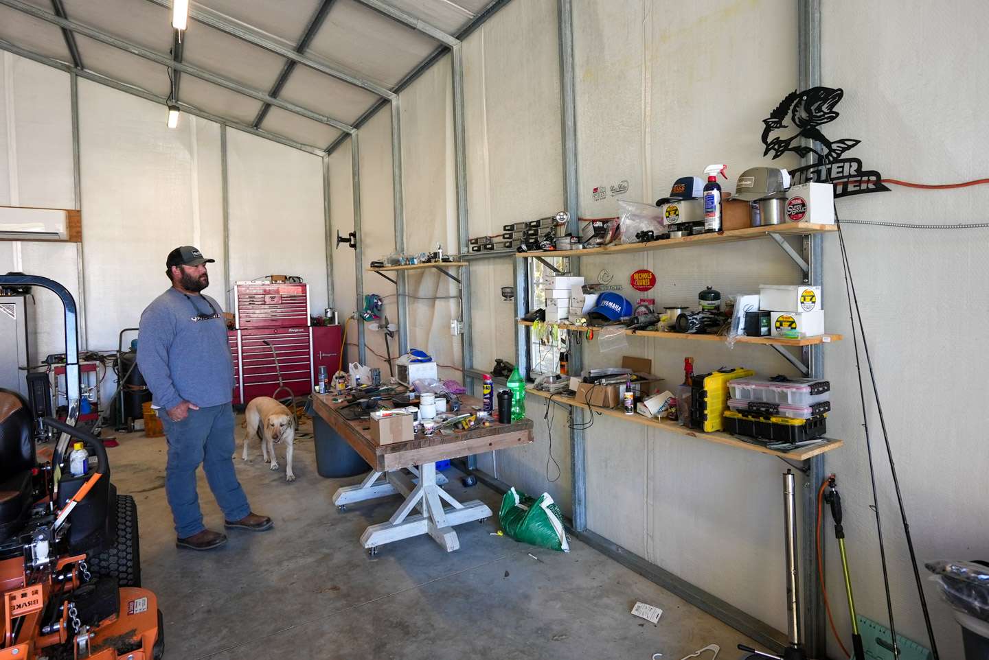 The right side of Davis' man cave is home to a mixture of things â tackle, hats, boat cleaner and his work bench. 