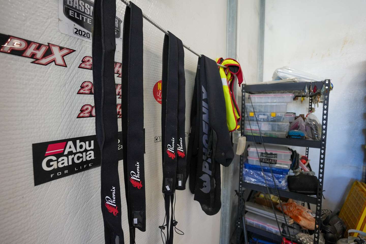 A wire hangs down the side of the shop, allowing him to hang items such as rod socks with ease. 