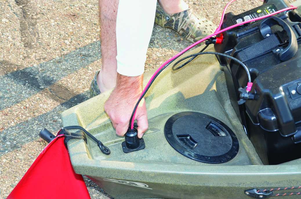 Lake saved weight with a $400 Fly Power lithium-ion battery that weighs 25 pounds â about half the weight of a comparable lead-acid battery. His battery box is on the deck behind him; he ran power wires under the deck to the bow.
