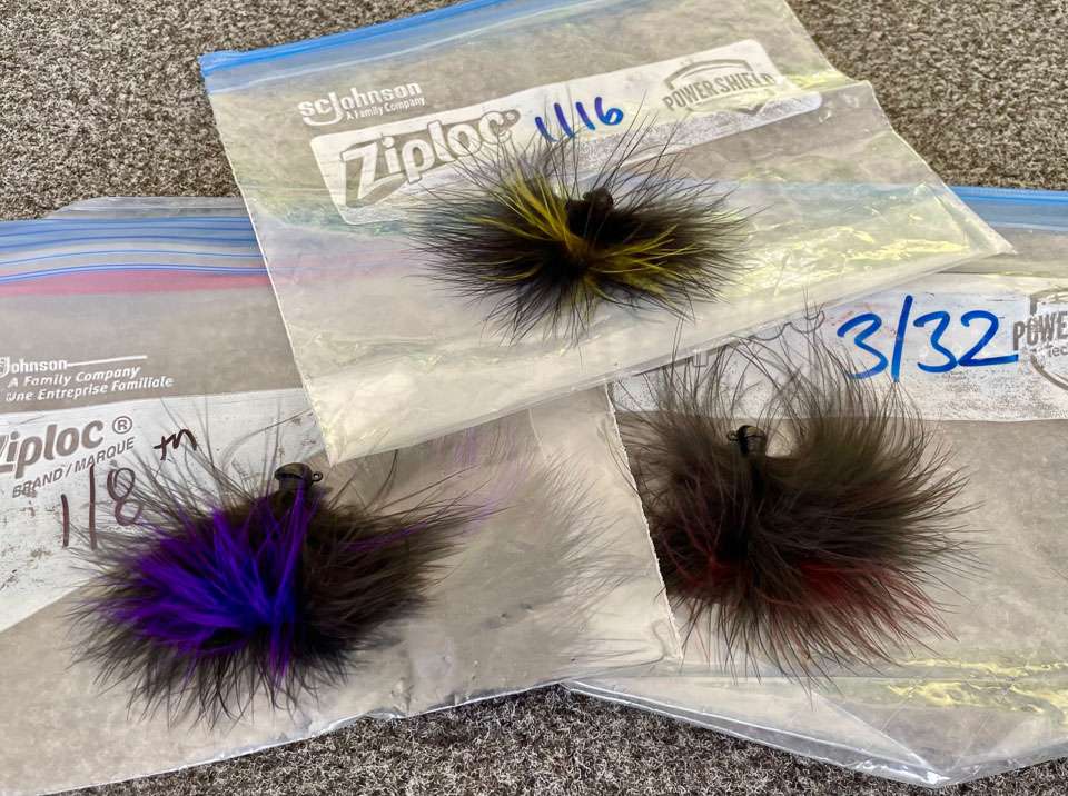 Making multiple sizes of his own homemade version, he stores them in Ziploc bags marked with weights. To visually sort his baits on the fly, he accents his dark marabou skirts with accent colors matched to each size.