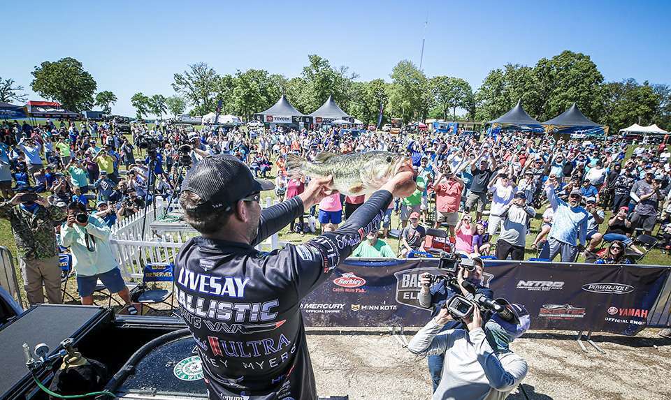 <figcaption>Livesay shows the Lake Fork crowd his biggest bass.</figcaption>