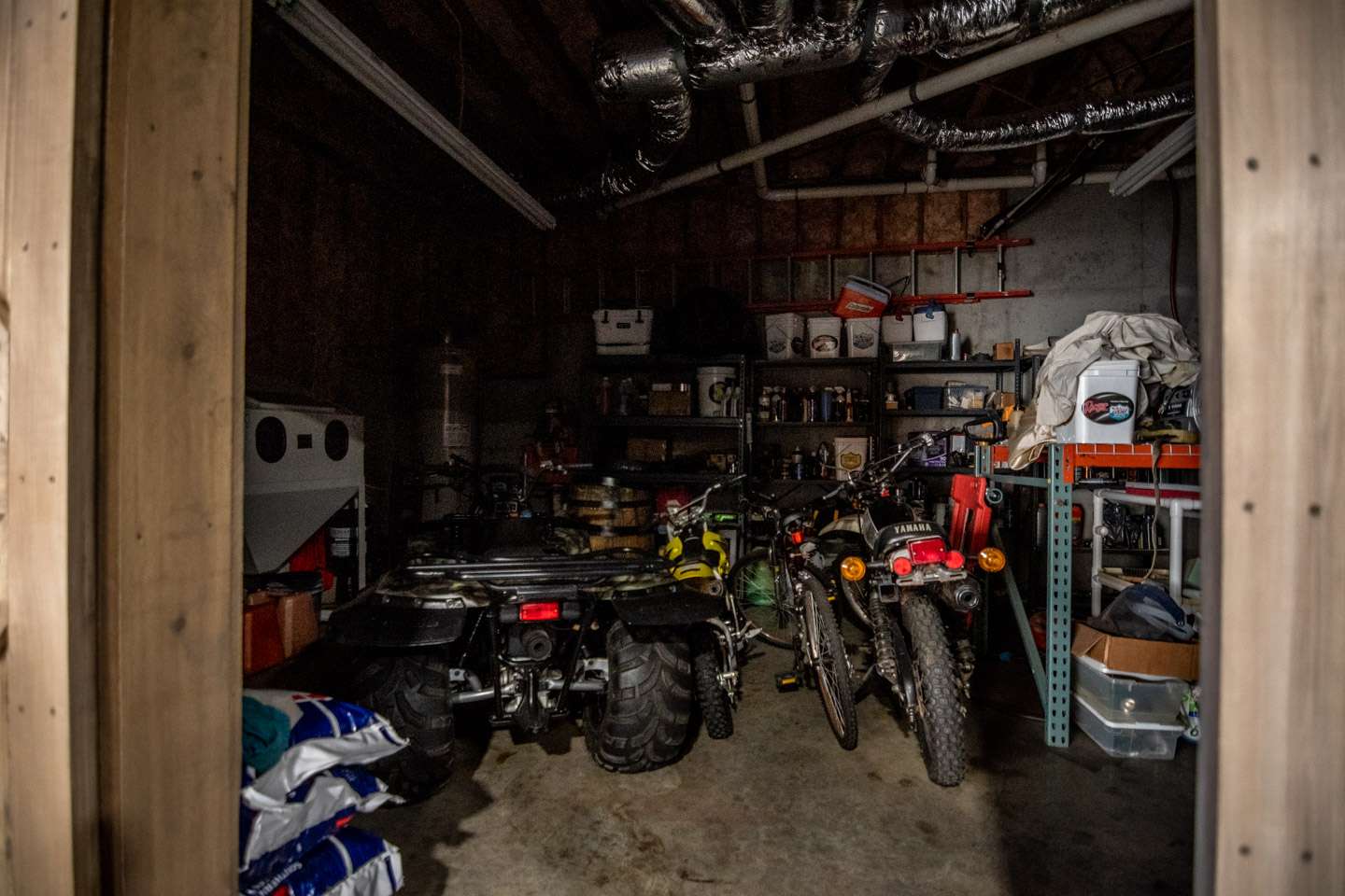 Next to his boat and toolbox is a miscellaneous room full of more tools, dirt bikes, a four-wheeler and everything in between. 