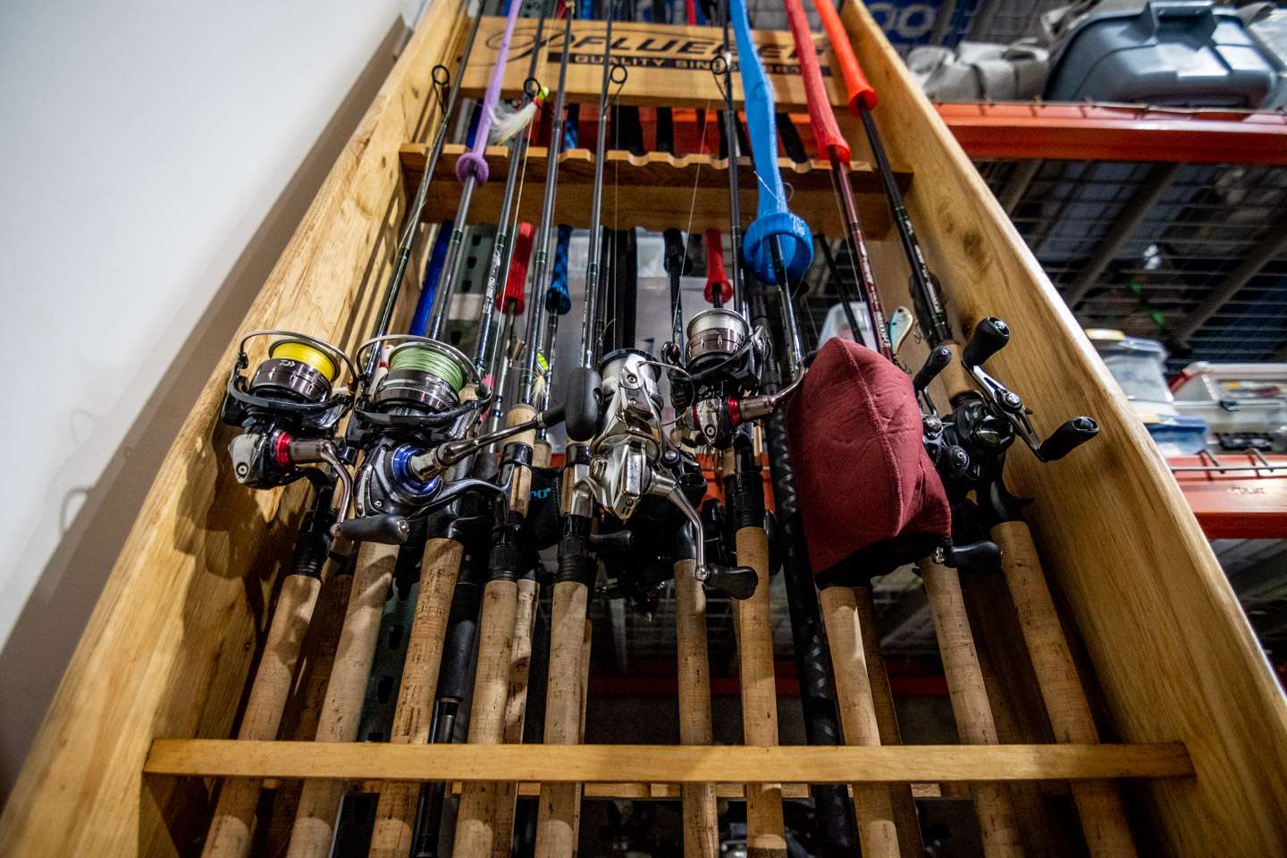This rack holds most of his spinning reels with a few baitcasters included.