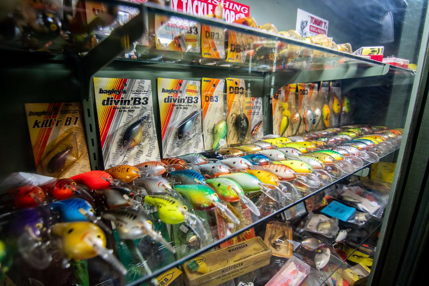 The middle shelf holds the spotlight on a variety of vintage Bagley crankbaits. 