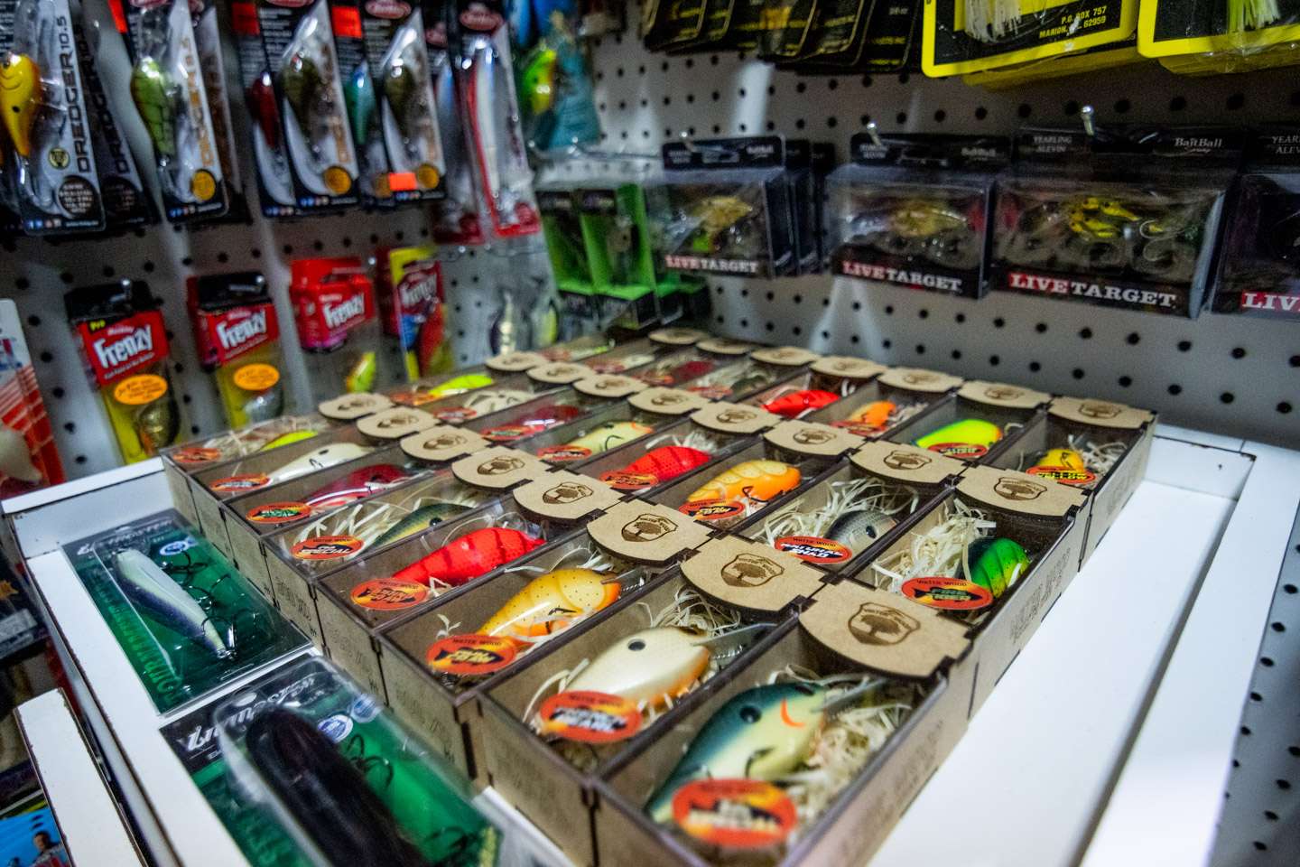 A small table along the wall is a great place to stock a variety of Water Wood custom baits. 