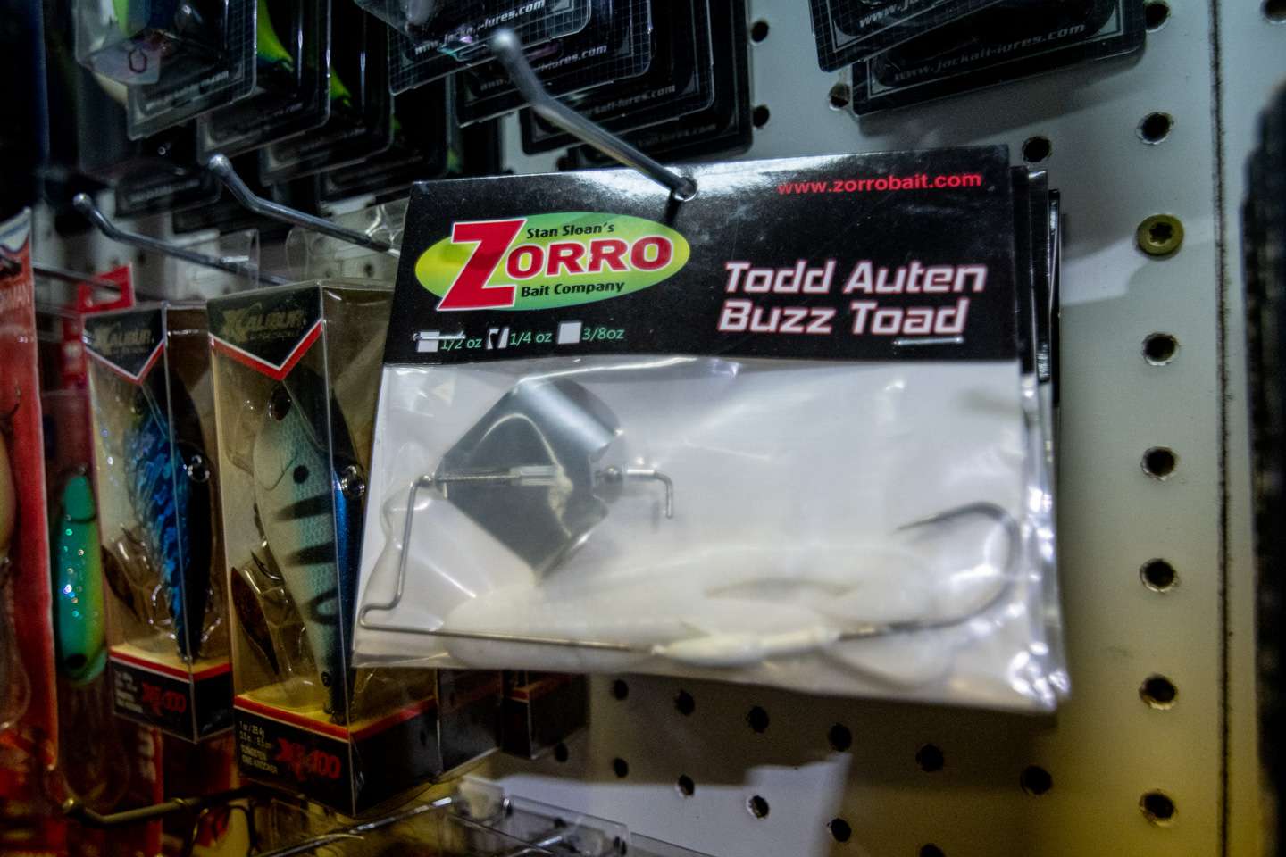 Auten’s signature buzz toad, from his past sponsorship with Zorro, is one of the many items hanging along his pegboard wall. 
