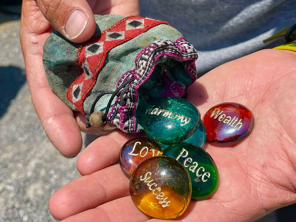 When Jocumsen first came to the U.S. in 2009, his mom Shelly and sister Sarah gave him a bag of polished stones with motivational words such as Harmony, Love, Peace, Wealth and Success. He carries these symbols of family support every day in his boat.