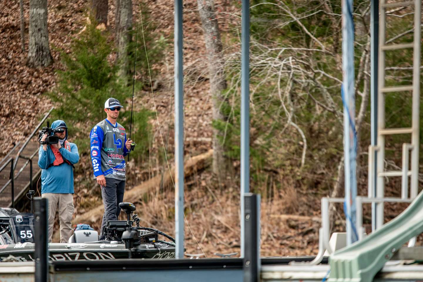 Palmer is fishing with a finesse set up, using a wacky rig to fish the docks.
